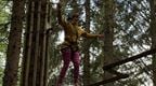 Woman participating on Go Ape Treetop Challenge